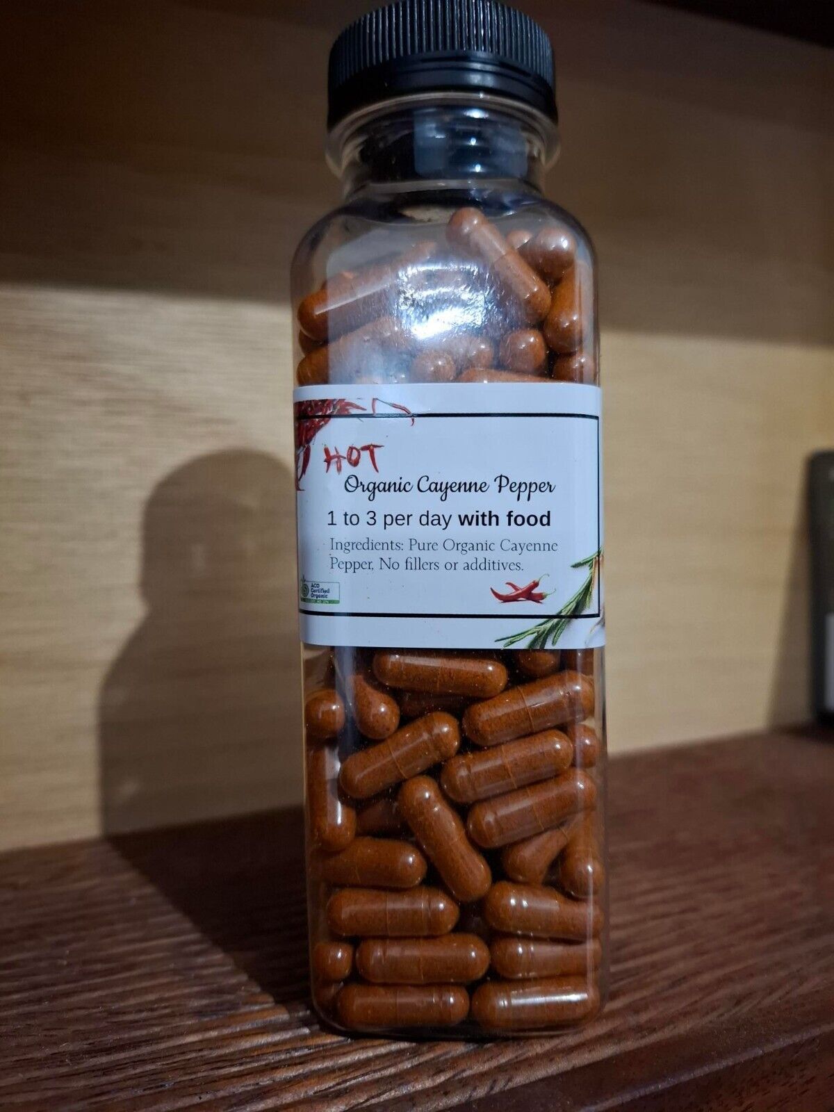 Organic cayenne pepper capsules in a bottle